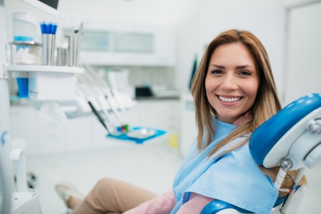 Confident patient flaunting her smile after cosmetic dental treatment in Fenton, MO