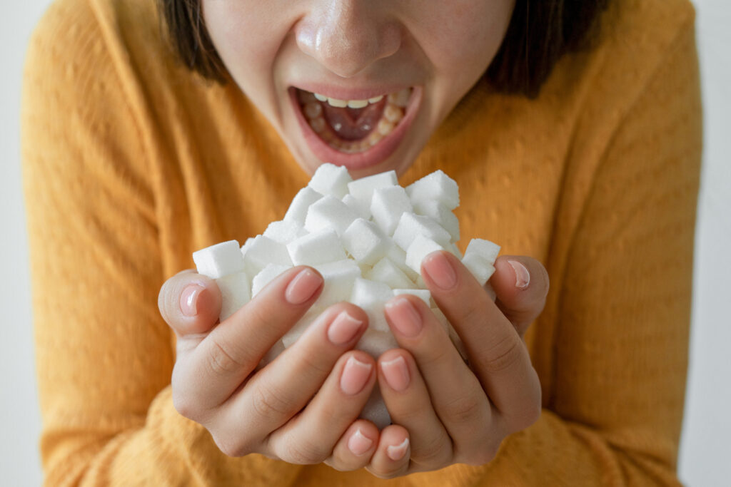 Woman addicted on sugar is eating